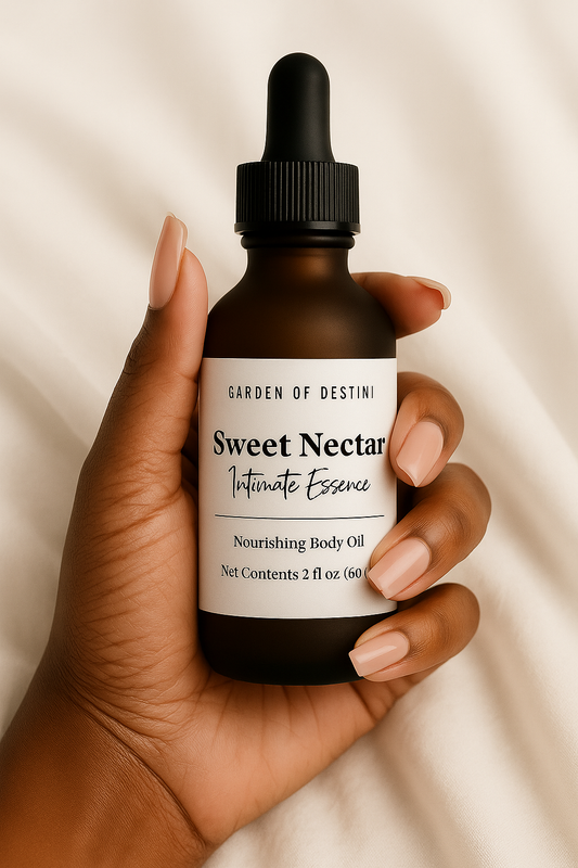 Sweet Nectar luxury women’s body oil in frosted amber bottle held in hands with natural light